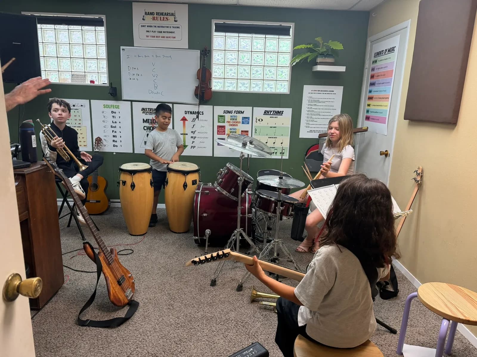 Campers in a music lesson with instruments